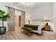 Bright bedroom boasts a king-sized bed and unique sliding barn doors at 170 Boulevard Se # 412E, Atlanta, GA 30312