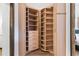 A custom closet featuring custom wood shelving, cabinets and drawers at 170 Boulevard Se # 412E, Atlanta, GA 30312