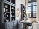 Elegant dining area features built-in shelving, a modern table, and a large window at 170 Boulevard Se # 412E, Atlanta, GA 30312