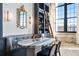 Dining nook features a booth, stylish table, and accent lighting, with a mirror and ladder bookcase at 170 Boulevard Se # 412E, Atlanta, GA 30312