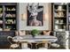 Dining area boasts a unique table and chairs setup, with stylish decor and built-in black shelving at 170 Boulevard Se # 412E, Atlanta, GA 30312