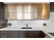 The kitchen sink sits below designer cabinets and counter tops at 170 Boulevard Se # 412E, Atlanta, GA 30312