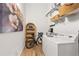 Convenient laundry area with modern washer and dryer, wicker baskets, a bike and plenty of storage options at 170 Boulevard Se # 412E, Atlanta, GA 30312