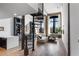 Open-concept living area with spiral staircase, hardwood floors, and exposed brick accents at 170 Boulevard Se # 412E, Atlanta, GA 30312