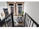 Open-concept living area with exposed brick, tall windows and stairs at 170 Boulevard Se # 412E, Atlanta, GA 30312