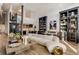 Spacious living room featuring a large sofa, spiral staircase, open-plan kitchen, and black shelving units at 170 Boulevard Se # 412E, Atlanta, GA 30312