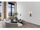 Bright living room boasts exposed brick, large windows, and modern decor at 170 Boulevard Se # 412E, Atlanta, GA 30312