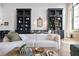 Bright living area with expansive windows, comfortable seating, and custom shelving for storage and display at 170 Boulevard Se # 412E, Atlanta, GA 30312