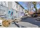 Outdoor patio with picnic tables, gravel, string lights, and colorful artwork at 170 Boulevard Se # 412E, Atlanta, GA 30312