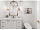 Chic powder room with white vanity, ornate mirror and a sleek toilet at 170 Boulevard Se # 412E, Atlanta, GA 30312