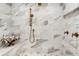 A modern shower featuring marble tile, a rain shower head and bronze hardware at 170 Boulevard Se # 412E, Atlanta, GA 30312