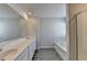 Modern bathroom with a double vanity, a soaking tub, and a glass shower at 1883 Frisco Way, Suwanee, GA 30024