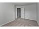 Neutral bedroom featuring plush carpet and a gray-painted door at 1883 Frisco Way, Suwanee, GA 30024
