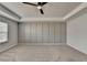 Spacious bedroom with neutral tones, a ceiling fan, and carpet floors at 1883 Frisco Way, Suwanee, GA 30024