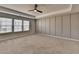 Spacious bedroom with neutral tones, a ceiling fan, and carpet floors at 1883 Frisco Way, Suwanee, GA 30024