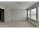 Bright bedroom with neutral walls, plush carpet, and three large windows at 1883 Frisco Way, Suwanee, GA 30024