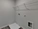 Utility room featuring a shelf, washer hookups, and durable flooring at 1883 Frisco Way, Suwanee, GA 30024