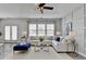 Comfortable living room with a large sectional sofa, stylish decor, and plenty of natural light at 1883 Frisco Way, Suwanee, GA 30024