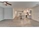 Spacious living room with wood flooring and view into kitchen area with stainless steel appliances at 1883 Frisco Way, Suwanee, GA 30024