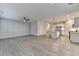 Open floor plan of the living room and kitchen featuring hardwood floors and modern fixtures at 1883 Frisco Way, Suwanee, GA 30024