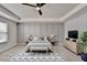 Beautiful main bedroom featuring neutral tones, a ceiling fan, and ample space at 1883 Frisco Way, Suwanee, GA 30024