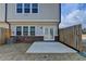 Backyard featuring a patio with privacy fence, lawn, and partial views of neighborhood at 1883 Frisco Way, Suwanee, GA 30024