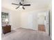 This cozy bedroom features carpeted floors, a ceiling fan, and windows for natural light at 4153 Brenda Dr, Decatur, GA 30035