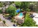 Stunning aerial view of the community pool and tennis court surrounded by lush greenery and manicured landscaping at 20 Ivy Ne Rdg, Atlanta, GA 30342
