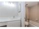 A bathroom features a tiled shower, a bathtub, a toilet, and a marble-topped sink at 20 Ivy Ne Rdg, Atlanta, GA 30342