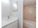 The bathroom features a marble countertop, a tub, a shower, and tiled walls at 20 Ivy Ne Rdg, Atlanta, GA 30342