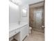 Updated bathroom with double vanity and tiled walk-in shower at 20 Ivy Ne Rdg, Atlanta, GA 30342