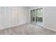 A bedroom features carpet, a sliding glass door to a deck, and two closets at 20 Ivy Ne Rdg, Atlanta, GA 30342