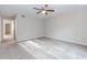 Spacious carpeted bedroom with a ceiling fan and neutral paint at 20 Ivy Ne Rdg, Atlanta, GA 30342