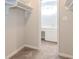 An open closet with shelves looks into a bathroom with a sink and vanity at 20 Ivy Ne Rdg, Atlanta, GA 30342