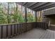 This back deck offers views of lush green trees at 20 Ivy Ne Rdg, Atlanta, GA 30342