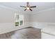 Light-filled dining room with modern flooring, wainscoting, and a view of the landscaped yard at 20 Ivy Ne Rdg, Atlanta, GA 30342