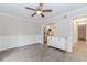 Bright living room with modern flooring, wainscoting, and ceiling fan at 20 Ivy Ne Rdg, Atlanta, GA 30342