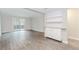 Spacious living room with grey wood floors and sliding glass door to patio at 20 Ivy Ne Rdg, Atlanta, GA 30342