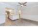 Open floor plan living room with modern flooring, wainscoting, and access to kitchen and stairs at 20 Ivy Ne Rdg, Atlanta, GA 30342