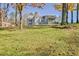 Expansive backyard with mature trees and ample space for outdoor activities at 205 Pine Knott Rd, Fayetteville, GA 30214