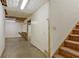 The basement area with stairs offers a blank canvas for your projects and has easy access to the upper floors at 205 Pine Knott Rd, Fayetteville, GA 30214