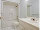 Bathroom featuring a shower-tub combo, tile floors, and a single sink vanity at 205 Pine Knott Rd, Fayetteville, GA 30214