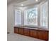 Close up on the built-in seat beneath a bay window with views of the backyard trees at 205 Pine Knott Rd, Fayetteville, GA 30214