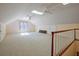 This bonus room features carpeted floors, skylights, windows, and ceiling fans for comfort at 205 Pine Knott Rd, Fayetteville, GA 30214