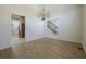 Dining room with modern flooring and adjacent view to the kitchen and stairs at 205 Pine Knott Rd, Fayetteville, GA 30214
