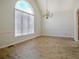 Dining room with wood floors, a decorative chandelier, and a large window at 205 Pine Knott Rd, Fayetteville, GA 30214