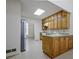 Open kitchen with wooden cabinets, skylight, and modern appliances at 205 Pine Knott Rd, Fayetteville, GA 30214