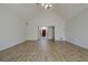 Spacious living room with wood floors, vaulted ceiling, and an open entryway at 205 Pine Knott Rd, Fayetteville, GA 30214