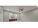 Spacious main bedroom with neutral carpet, bay window, and ceiling fan at 205 Pine Knott Rd, Fayetteville, GA 30214