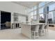 Well-appointed kitchenette area with stone counters, bar seating, and city views enhances the resident experience at 3325 Piedmont Ne Rd # 1907, Atlanta, GA 30305